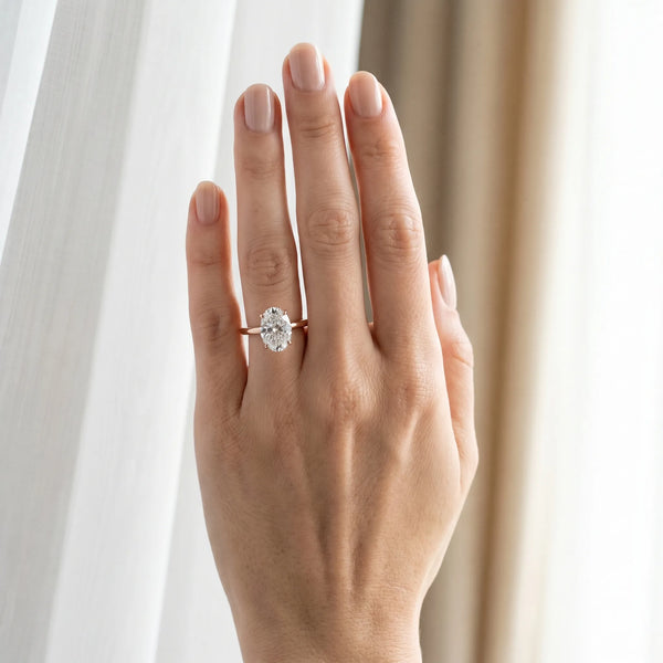 Rose gold Oval Diamond Solitaire Ring with Slim Band and Four-Prong Setting