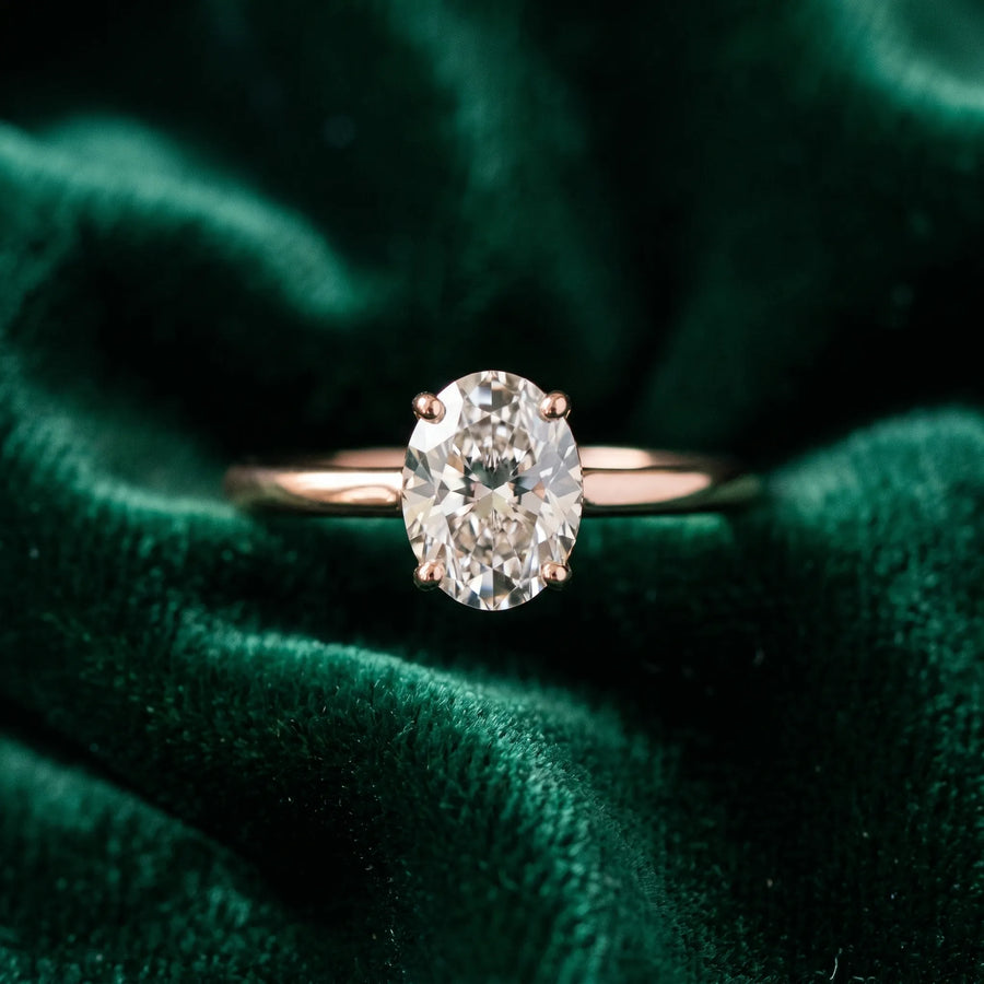 Rose gold Oval Diamond Solitaire Ring with Slim Band and Four-Prong Setting
