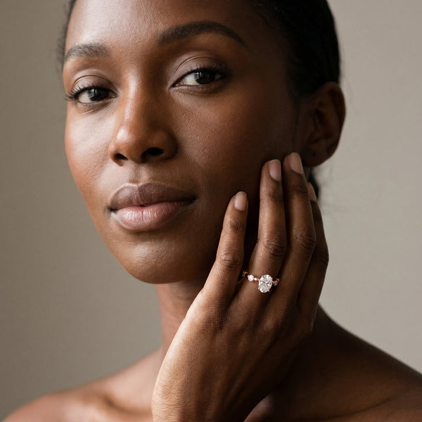 Rose gold Oval Solitaire Bezel-Set Diamond Ring with Beaded Band and Four-Prong Setting