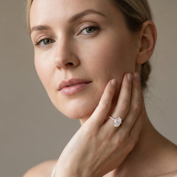 Rose gold Oval Solitaire Diamond Engagement Ring with Pave Band and Six-Prong Setting