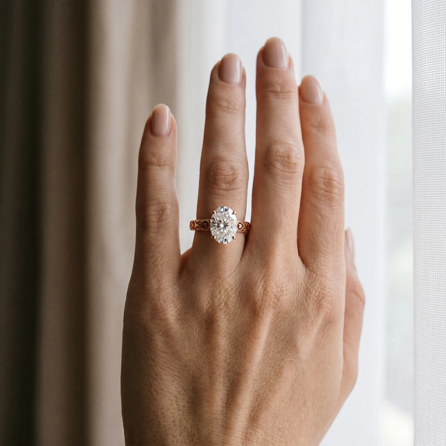 Rose gold Oval Solitaire Diamond Engagement Ring with XO Engraved Band and Four-Prong Setting