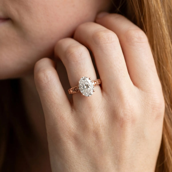 Rose gold Oval Solitaire Diamond Engagement Ring with XO Engraved Band and Four-Prong Setting