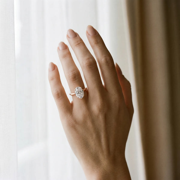 Rose gold Oval Solitaire Diamond Ring with Bamboo Band and Four-Prong Setting