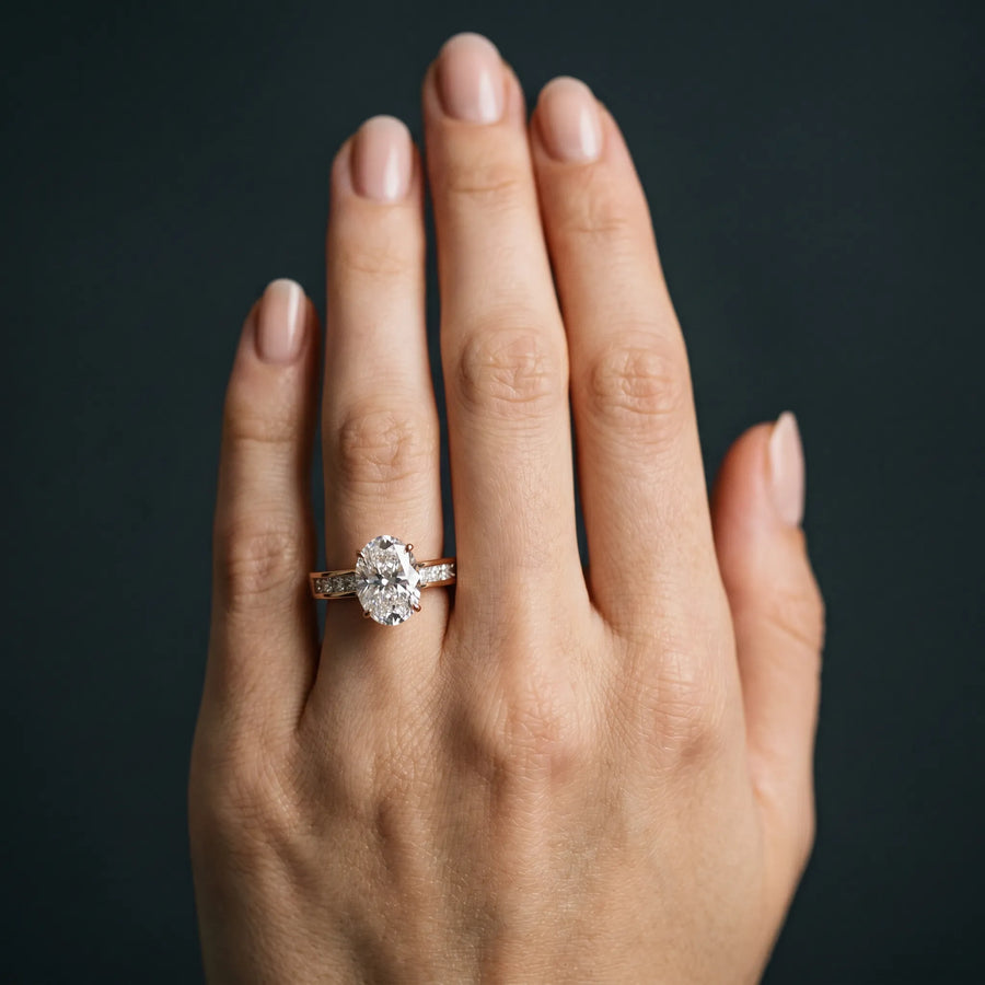 Rose gold Oval Solitaire Diamond Ring with Channel-Set Band and Four-Prong Setting