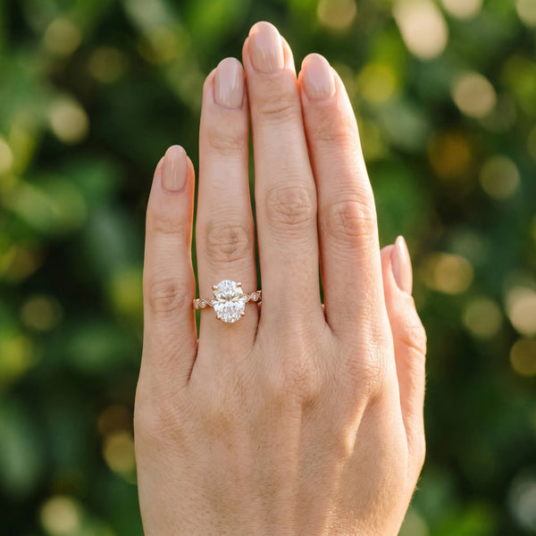 Rose gold Oval Solitaire Diamond Ring with Infinity Twist Band and Four-Prong Setting