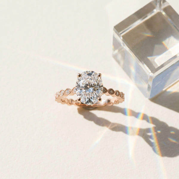 Rose gold Oval Solitaire Diamond Ring with Infinity Twist Band and Four-Prong Setting