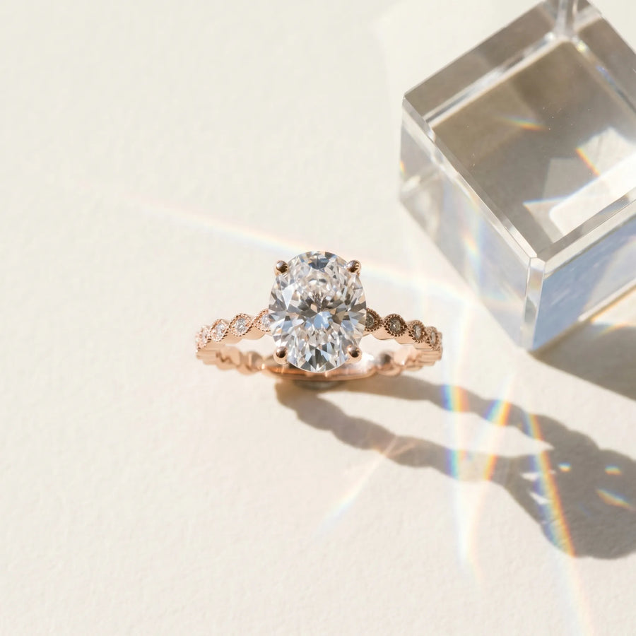 Rose gold Oval Solitaire Diamond Ring with Infinity Twist Band and Four-Prong Setting
