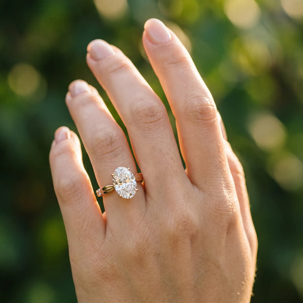 Rose gold Oval Solitaire Diamond Twisted Band with Four-Prong Setting