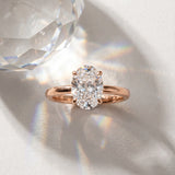 Rose gold Oval Solitaire Engagement Ring with Cathedral Band and Four-Prong Setting_18