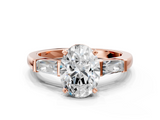 Rose gold Oval Solitaire with Tapered Baguette Side Stones on a Classic Band with Four-Prong Setting_130