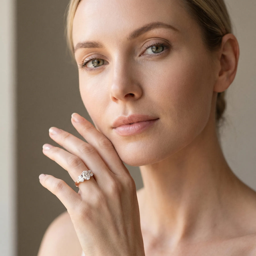 Rose gold Oval Three-Stone Diamond Ring with Solitaire Band and Four-Prong Setting