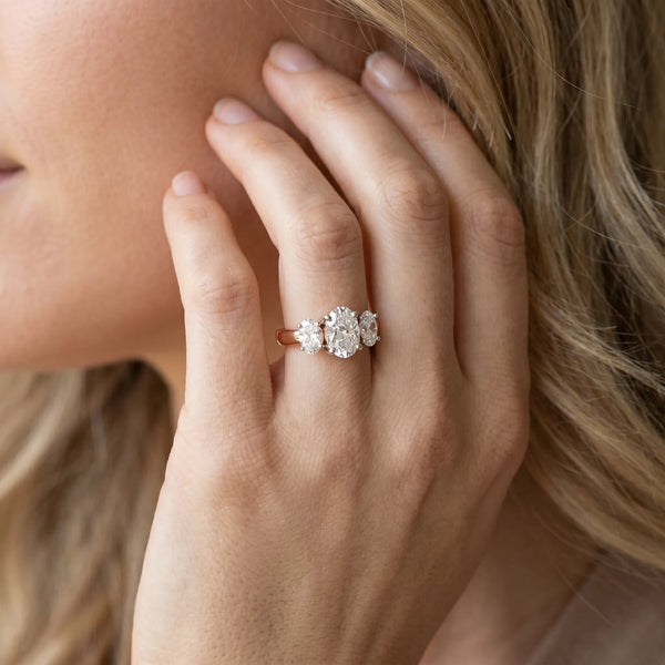 Rose gold Oval Three-Stone Diamond Ring with Solitaire Band and Four-Prong Setting