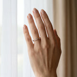 Rose gold Pavé Round Diamond Twist Eternity Band with Shared Prong Setting