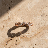 Rose gold Pavé Round Diamond Twist Eternity Band with Shared Prong Setting