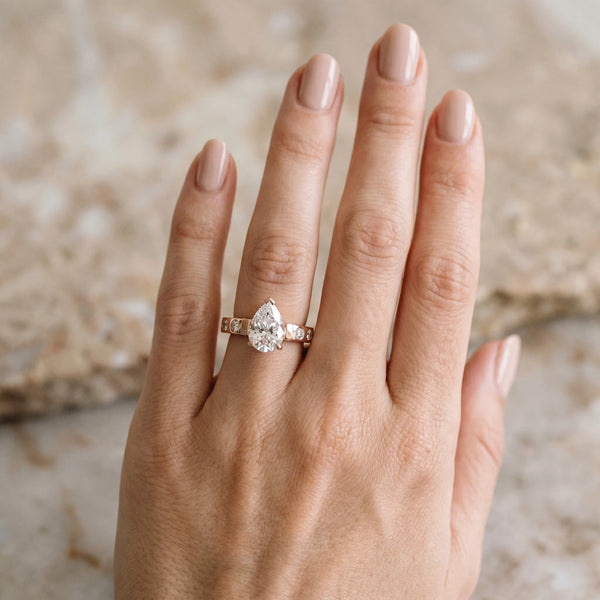 Rose gold Pear Brilliant Channel-Set Diamond Ring with Bezel Prong Setting