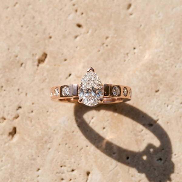 Rose gold Pear Brilliant Channel-Set Diamond Ring with Bezel Prong Setting