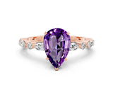 Rose gold Pear Cut Amethyst Solitaire with Side Stones on a Pavé Band and Four-Prong Setting