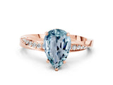 Rose gold Pear Cut Aquamarine Engagement Ring with Side Stone Accents and Four-Prong Setting_60