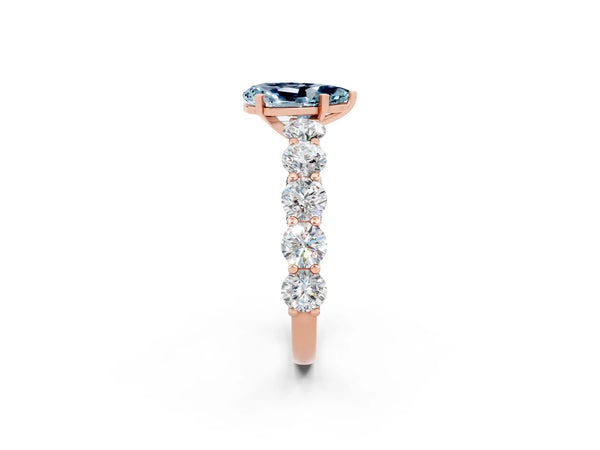 Rose gold Pear Cut Aquamarine Prong Setting with Side Stones on a Pave Band