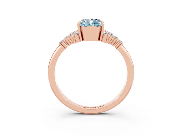 Rose gold Pear Cut Aquamarine Ring with Side Stones and Four-Prong Setting