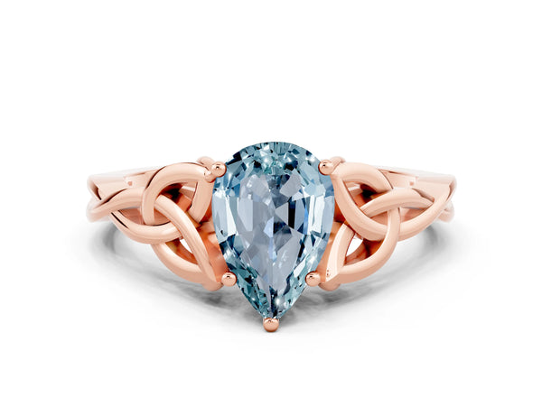 Rose gold Pear Cut Aquamarine Solitaire Engagement Ring with Celtic Knot Band and Four-Prong Setting