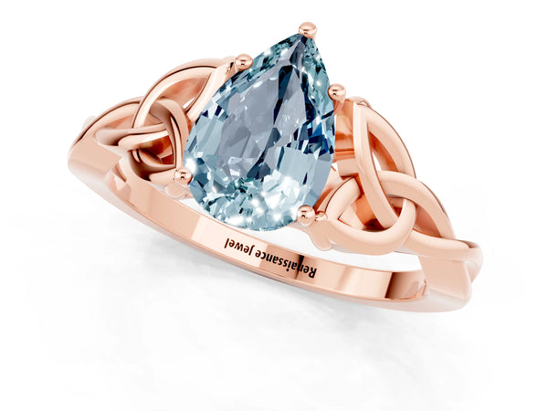 Rose gold Pear Cut Aquamarine Solitaire Engagement Ring with Celtic Knot Band and Four-Prong Setting