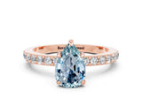 Rose gold Pear Cut Aquamarine Solitaire Engagement Ring with Pavé Band and Four-Prong Setting