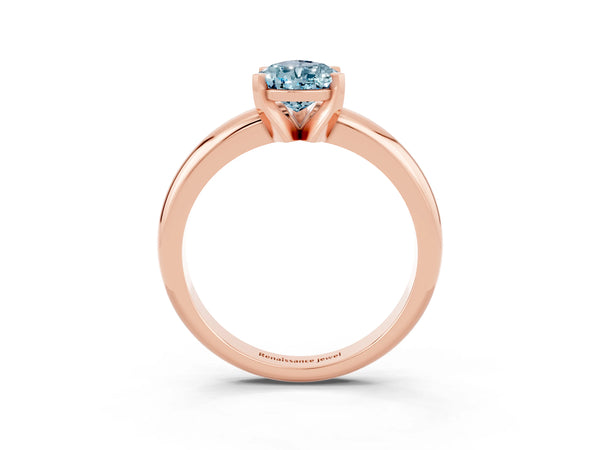 Rose gold Pear Cut Aquamarine Solitaire Engagement Ring with Round Band and Four-Prong Setting