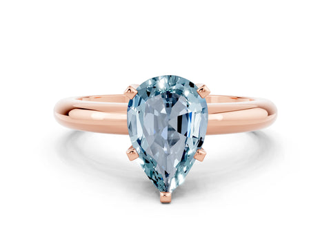 Rose gold Pear Cut Aquamarine Solitaire Engagement Ring with Round Band and Four-Prong Setting
