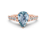 Rose gold Pear Cut Aquamarine Solitaire Ring with Cathedral Setting and Pavé Band