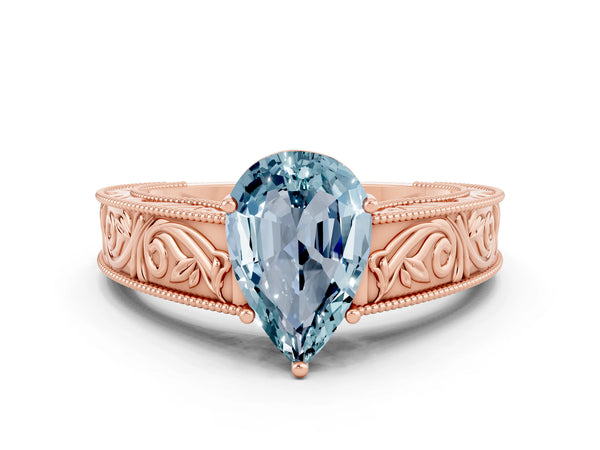 Rose gold Pear Cut Aquamarine Solitaire Ring with Engraved Band and Four-Prong Setting