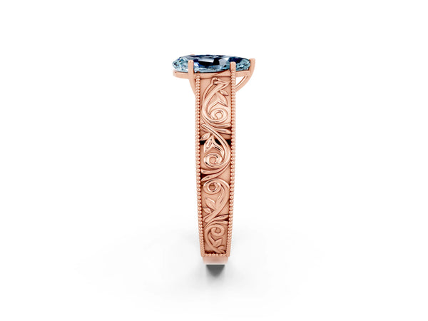Rose gold Pear Cut Aquamarine Solitaire Ring with Engraved Band and Four-Prong Setting