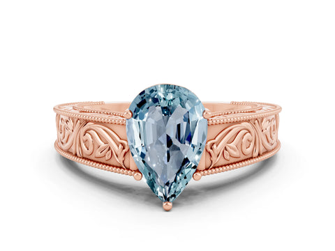 Rose gold Pear Cut Aquamarine Solitaire Ring with Engraved Band and Four-Prong Setting