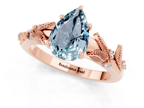 Rose gold Pear Cut Aquamarine Solitaire Ring with Leaf Motif Band and Four-Prong Setting_1