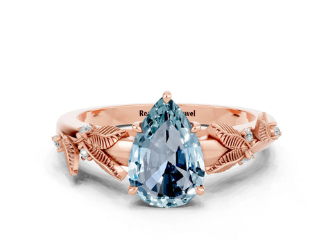 Rose gold Pear Cut Aquamarine Solitaire Ring with Leaf Motif Band and Four-Prong Setting
