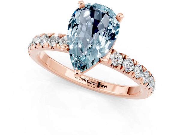 Rose gold Pear Cut Aquamarine Solitaire Ring with Pavé Accents and Four-Prong Setting