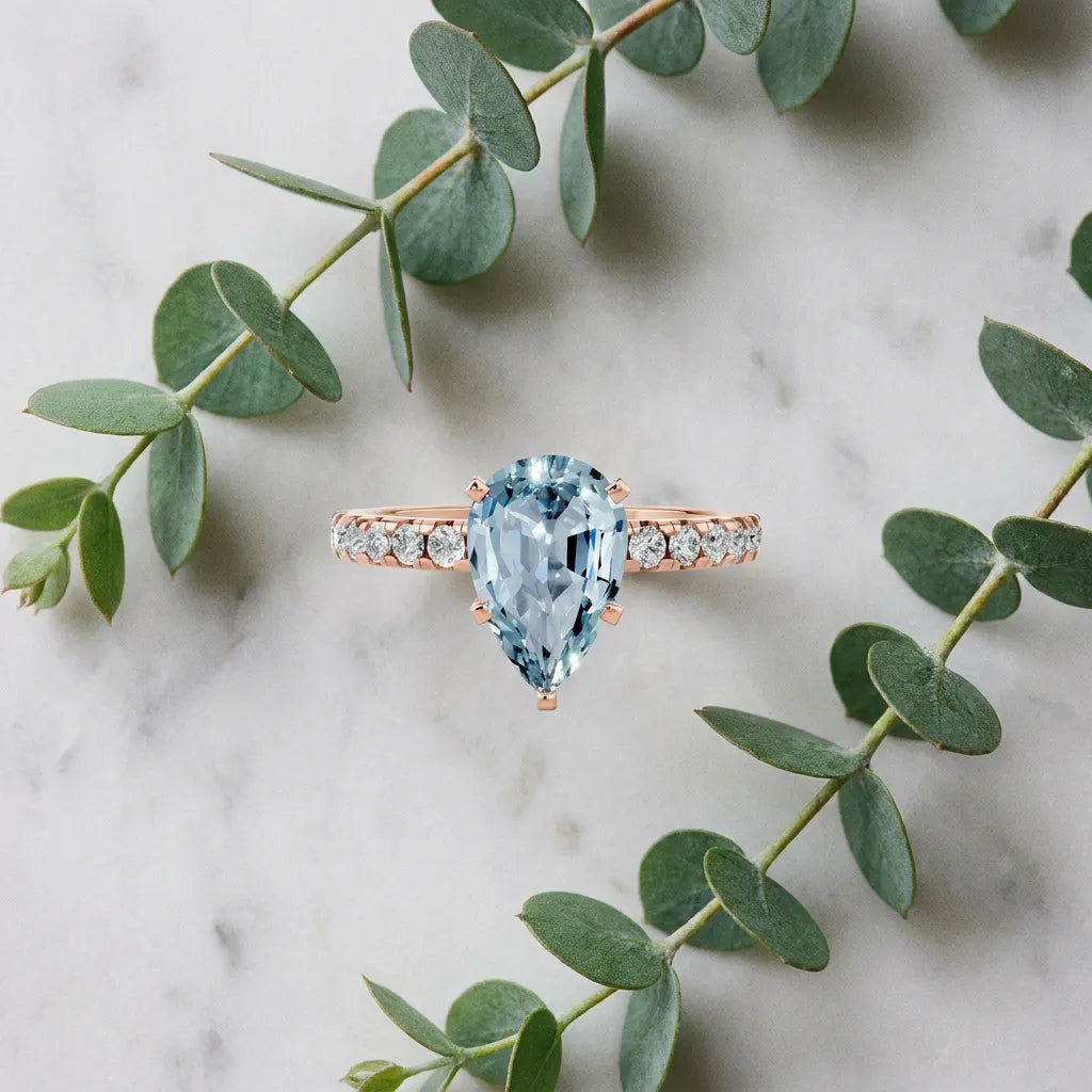 Rose gold Pear Cut Aquamarine Solitaire Ring with Round  Pavé Band and Four-Prong Setting_45