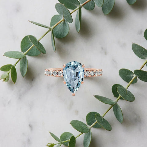 Rose gold Pear Cut Aquamarine Solitaire Ring with Round  Pavé Band and Four-Prong Setting_45