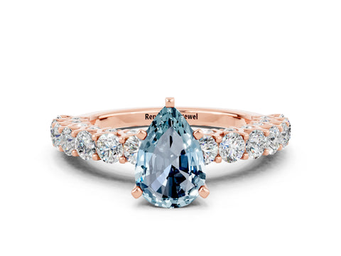 Rose gold Pear Cut Aquamarine Solitaire Ring with Shared Prong Pavé Band and Four-Prong Setting