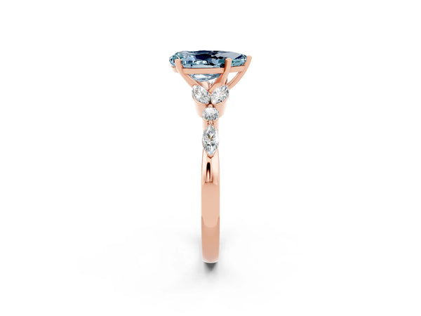 Rose gold Pear Cut Aquamarine Solitaire Ring with Side Stones and Four-Prong Setting