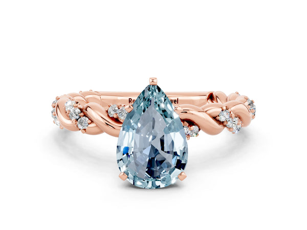 Rose gold Pear Cut Aquamarine Solitaire Ring with Twisted Band and Pavé Accents