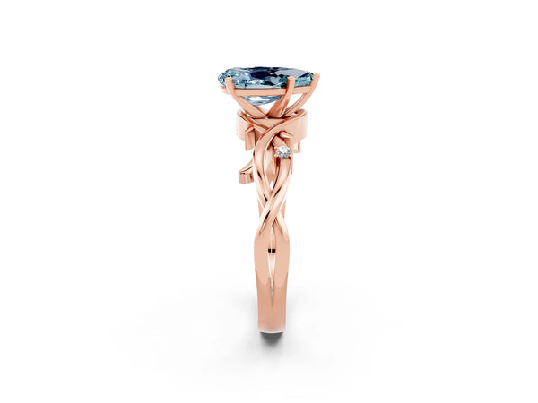 Rose gold Pear Cut Aquamarine Solitaire Ring with Twisted Band and Prong Setting