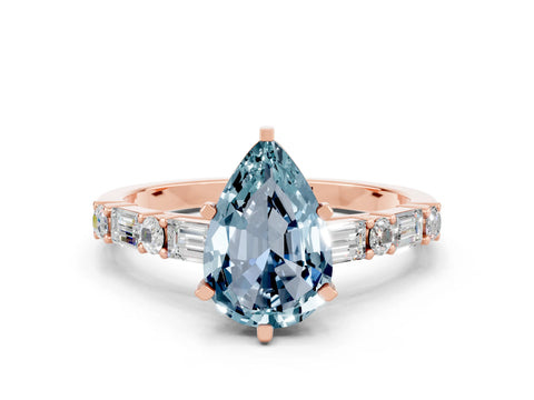 Rose gold Pear Cut Aquamarine Solitaire with Side Baguettes and Channel Set Band