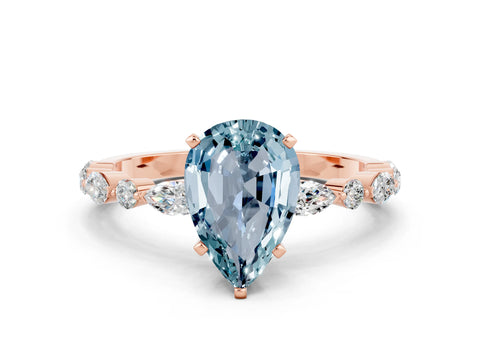 Rose gold Pear Cut Aquamarine Solitaire with Side Stones on a Pavé Band and Four-Prong Setting
