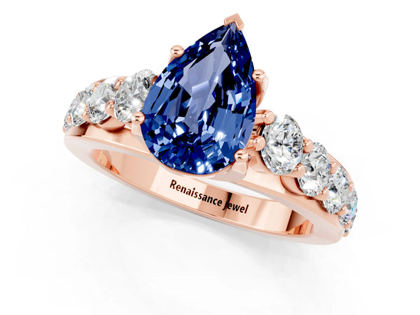Rose gold Pear Cut Blue Sapphire Engagement Ring with Pavé Band and Four-Prong Setting