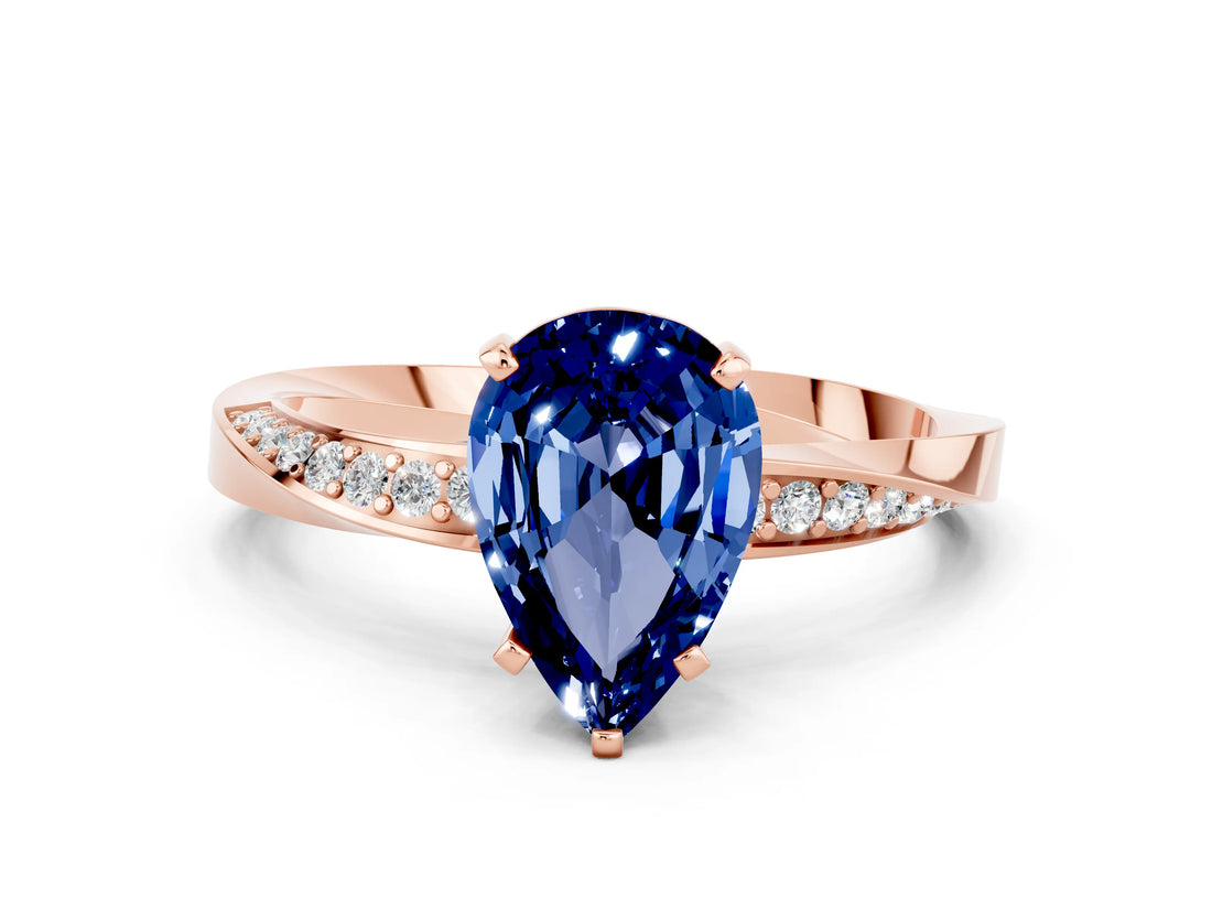 Rose gold Pear Cut Blue Sapphire Engagement Ring with Side Stone Accents and Four-Prong Setting_27