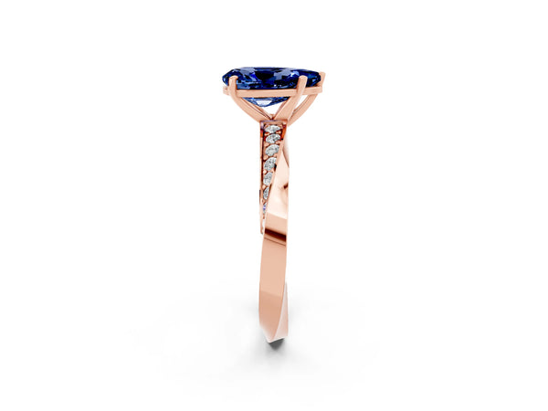 Rose gold Pear Cut Blue Sapphire Engagement Ring with Side Stone Accents and Four-Prong Setting