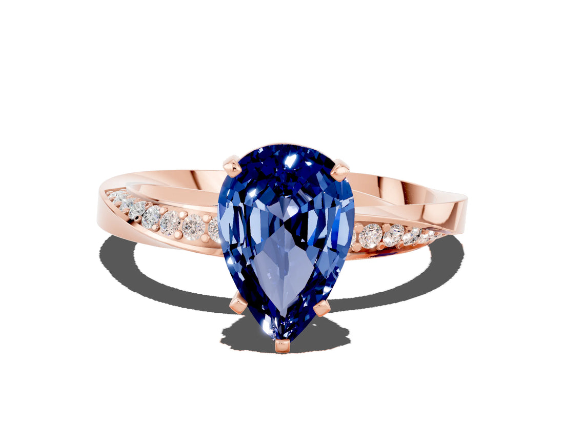 Rose gold Pear Cut Blue Sapphire Engagement Ring with Side Stone Accents and Four-Prong Setting_60