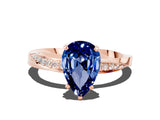 Rose gold Pear Cut Blue Sapphire Engagement Ring with Side Stone Accents and Four-Prong Setting_60