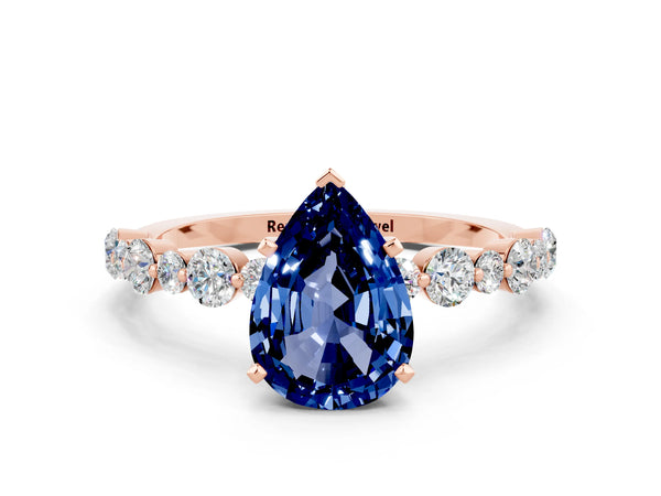 Rose gold Pear Cut Blue Sapphire Prong Set Engagement Ring with Pavé Band